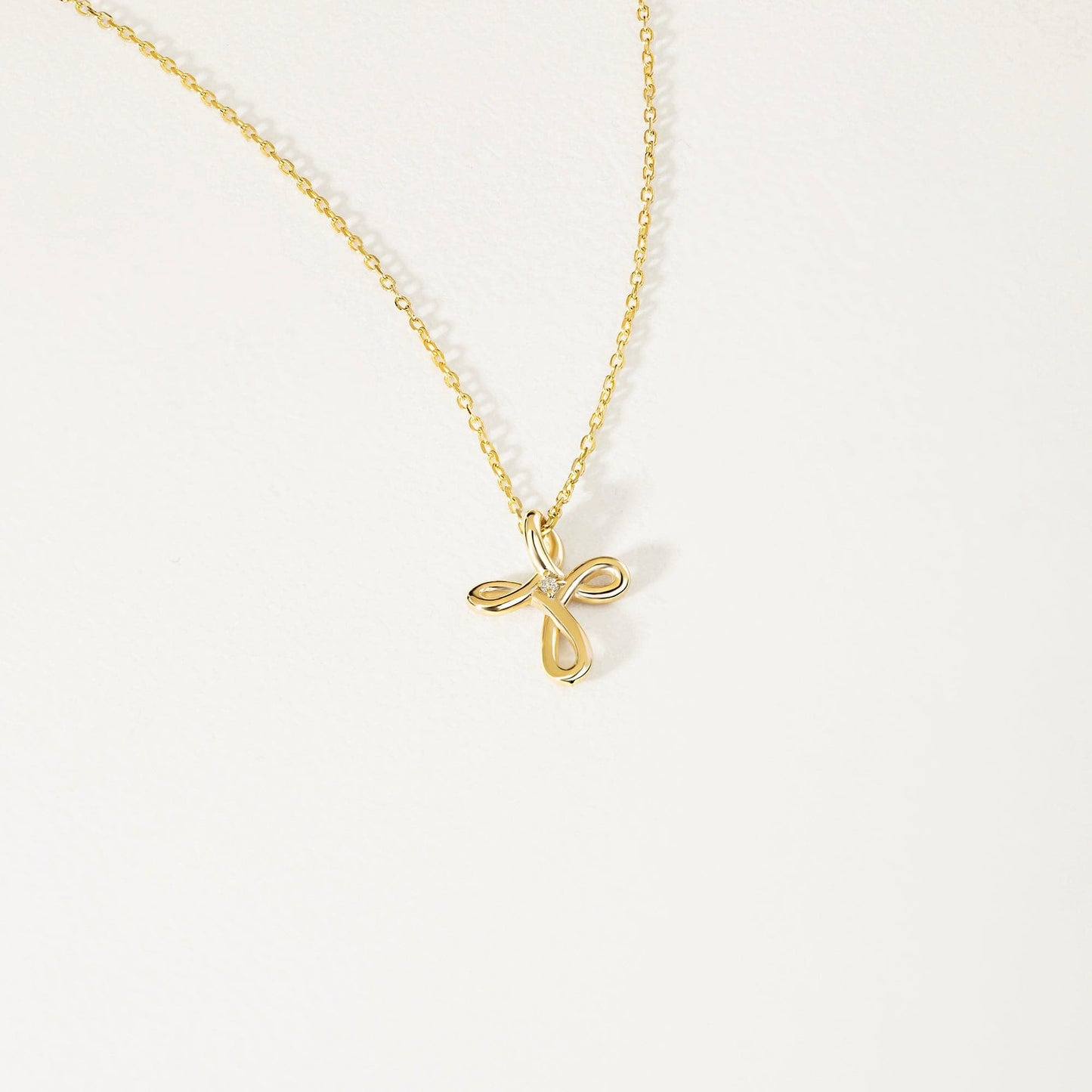 diamond cross infinity necklace made of 585 yellow gold