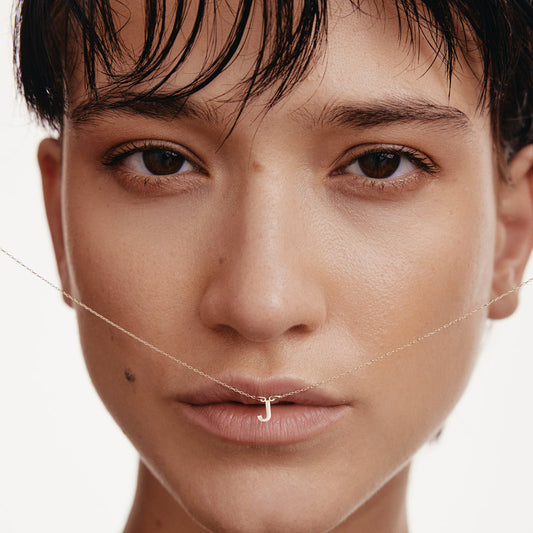 Individual delicate initial necklace in 585 gold