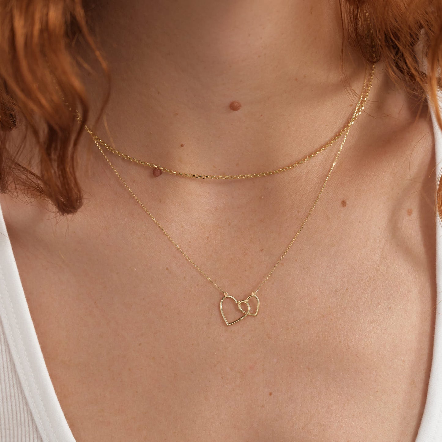 Intertwined heart necklace in 585 solid gold