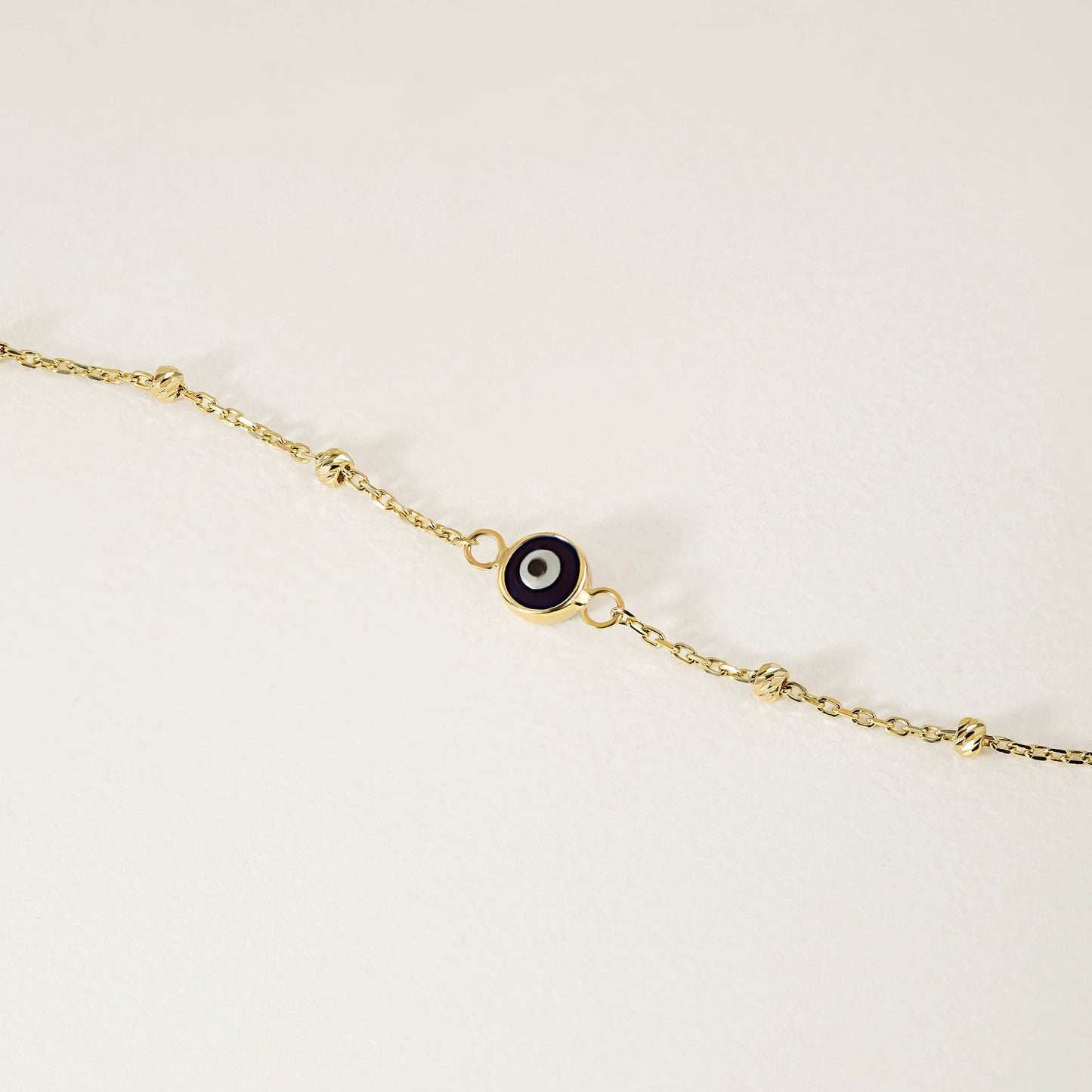 Collier de perles bracelet mauvais œil en or 585