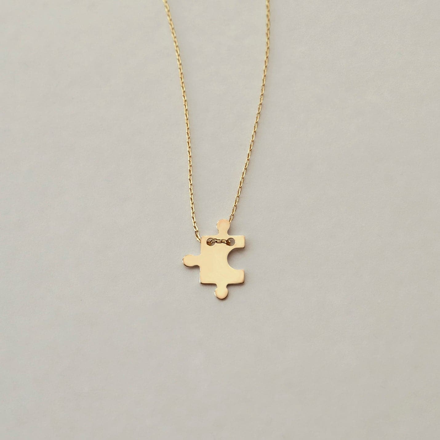 Collier pendentif pièce de puzzle en or 585
