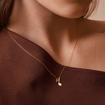 Collier avec pendentif note de musique en or 585