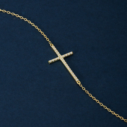 Horizontal cross bracelet made of 585 gold with diamond pave