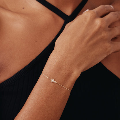 Tiny diamond cross bracelet made of 14K gold