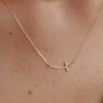 Sideways curved cross necklace made of 585 gold
