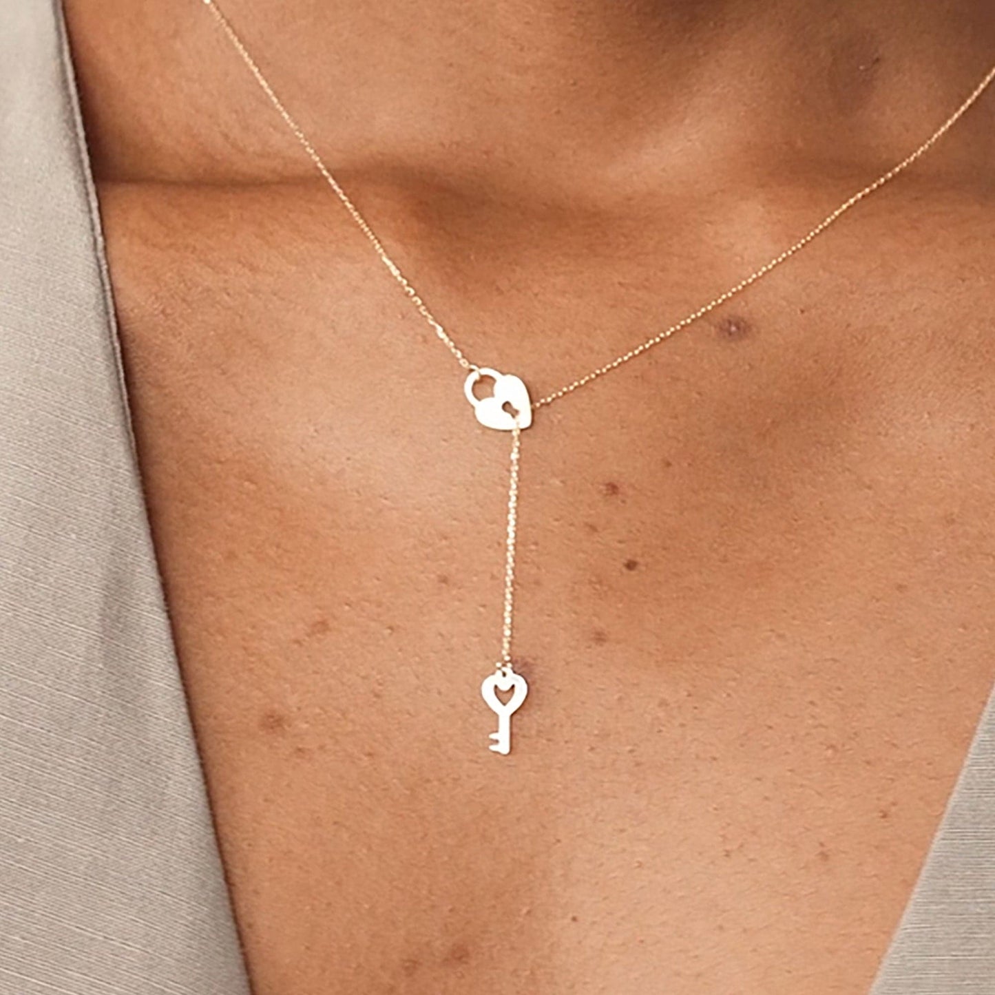 Serrure en forme de cœur et pendentif clé en or 585